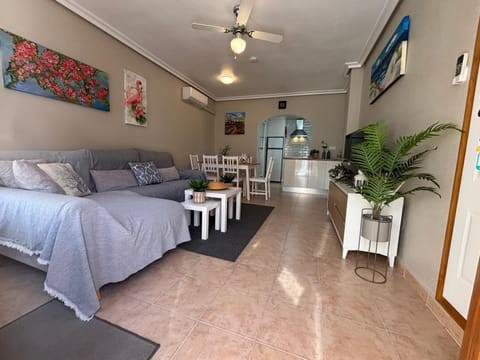 TV and multimedia, Kitchen or kitchenette, Living room, Photo of the whole room, Seating area, Dining area, air conditioner