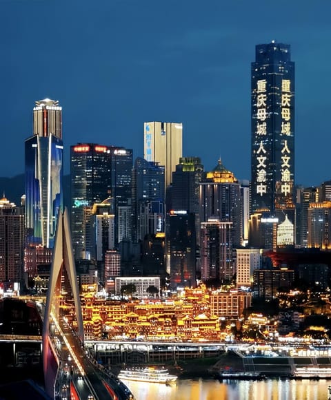 Property building, Nearby landmark, Night, Property logo or sign, Neighbourhood, Natural landscape, City view