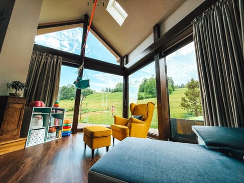 Bed, View (from property/room), Living room, Seating area, Garden view