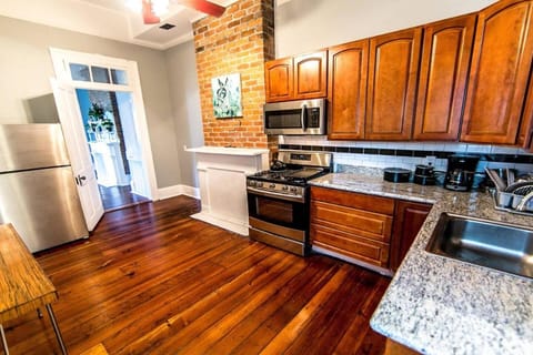 Kitchen or kitchenette, dishwasher, oven, stove