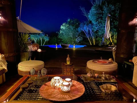 Communal lounge/ TV room, Night, Swimming pool
