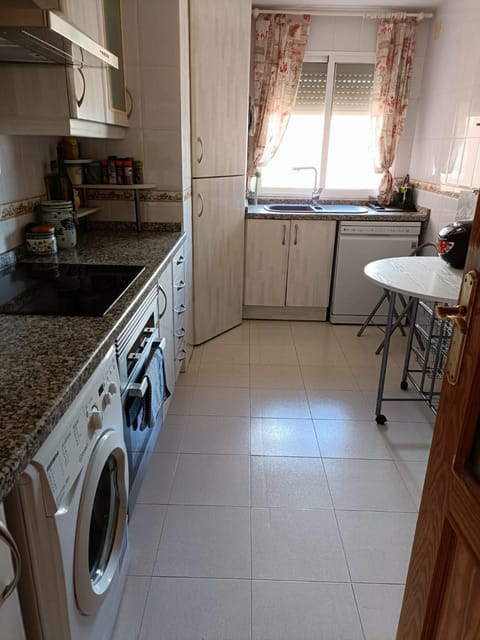 Kitchen or kitchenette, dishwasher, oven, stove, washing machine