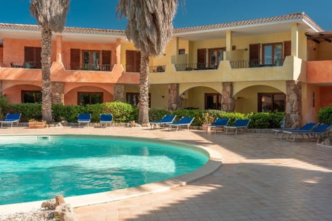 Property building, Patio, Pool view, Swimming pool, sunbed