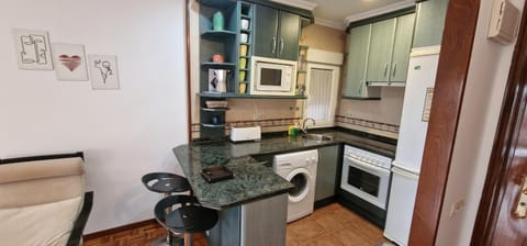 Kitchen or kitchenette, oven, stove
