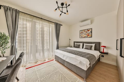 Bed, Living room, Seating area, Bedroom
