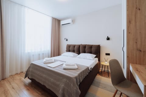 Bed, Photo of the whole room, Bedroom, towels, air conditioner