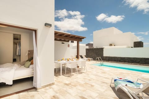 Property building, Patio, Bed, Day, View (from property/room), Balcony/Terrace, Bedroom, Pool view, Swimming pool, Swimming pool