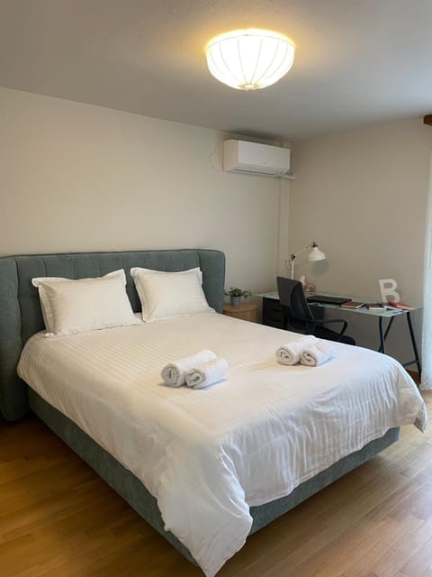 Bed, Photo of the whole room, Bedroom, towels, air conditioner