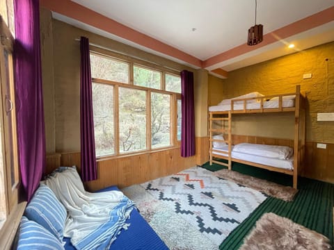 Property building, Bed, Photo of the whole room, Seating area, Bedroom, Text overlay, bunk bed