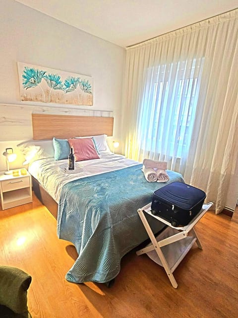 Bed, towels, wardrobe
