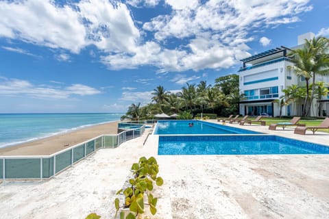 Property building, Natural landscape, Beach, Pool view, Sea view, Swimming pool, sunbed
