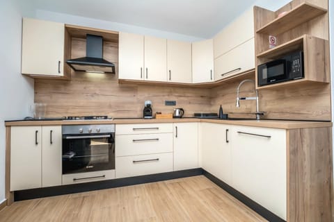 Kitchen or kitchenette, dishwasher, stove