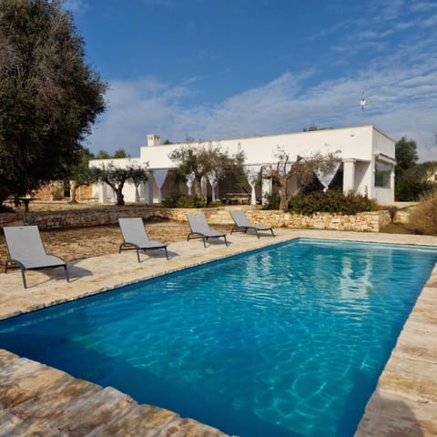 Property building, Patio, Pool view, Swimming pool, sunbed