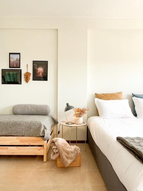 Bed, Living room, Seating area, Bedroom