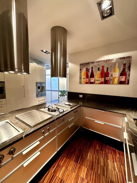 Kitchen or kitchenette, dishwasher, oven, stove