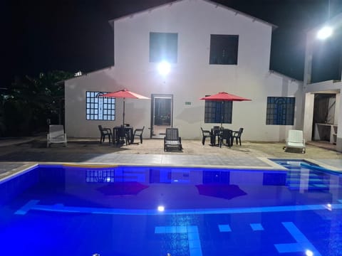 Property building, Patio, Night, Seating area, Pool view, Swimming pool, group of guests