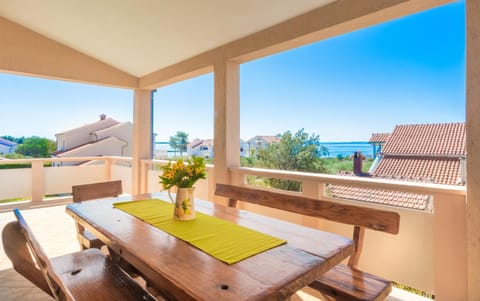 BBQ facilities, Balcony/Terrace, Dining area, Text overlay, Sea view