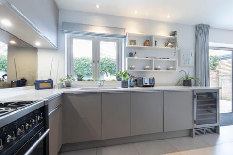 Kitchen or kitchenette, dishwasher, oven, stove, toaster