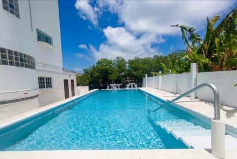 Property building, Day, Pool view, Swimming pool, sunbed