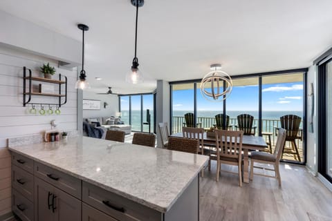 Kitchen or kitchenette, Living room, Seating area, Dining area, Sea view