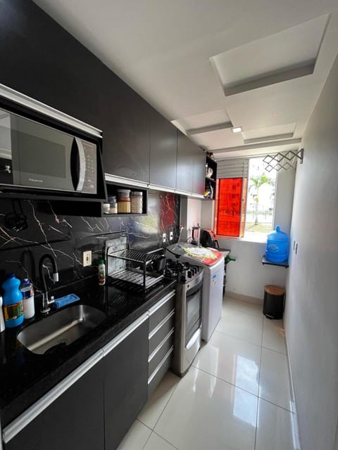 Kitchen or kitchenette, dishwasher, oven, stove