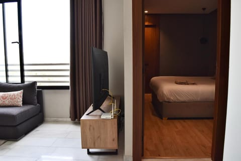 Communal lounge/ TV room, Bed, TV and multimedia, Living room, Photo of the whole room, Seating area, Evening entertainment, Bedroom, hair dresser