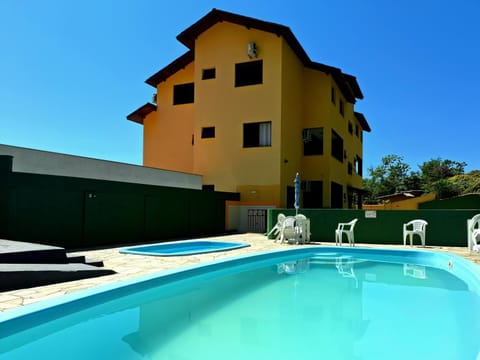 Property building, Day, Pool view, Swimming pool, sunbed