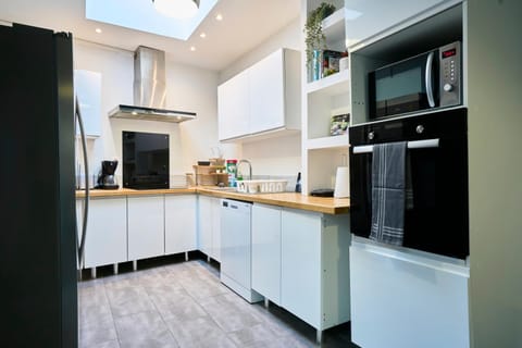 Kitchen or kitchenette, dishwasher, oven, stove, toaster