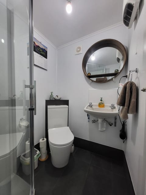 Shower, Toilet, Bathroom, hair dryier, towels