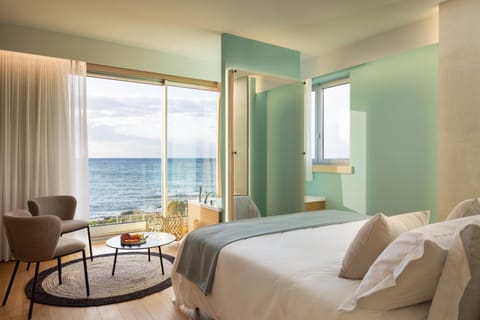 Bed, Natural landscape, Seating area, Bedroom, Sea view