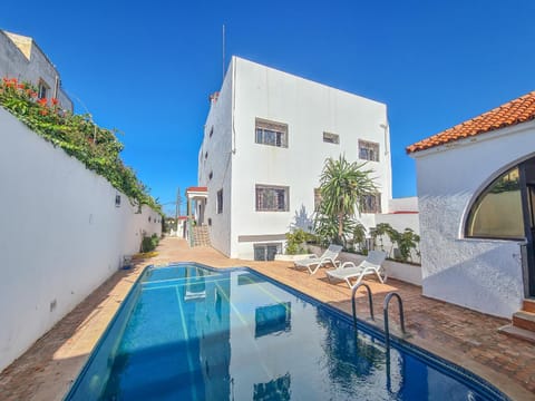 Property building, Pool view, Swimming pool, sunbed