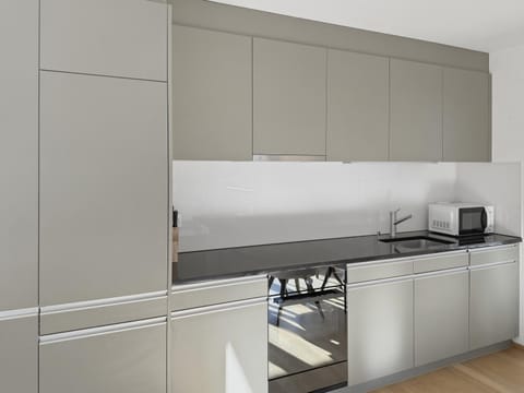 Kitchen or kitchenette, microwave, oven, stove, kitchen