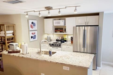Kitchen or kitchenette, dishwasher, oven, stove
