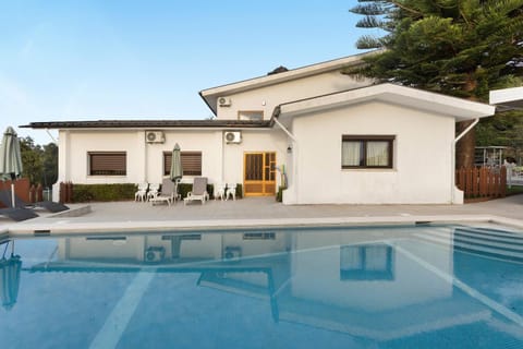 Property building, Living room, Swimming pool