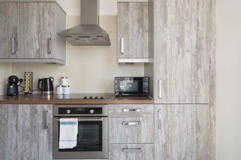 Kitchen or kitchenette, oven, stove