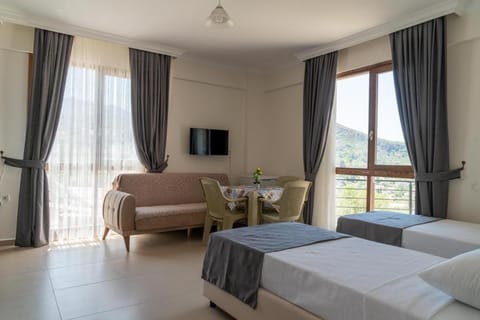 Communal lounge/ TV room, Bed, TV and multimedia, Photo of the whole room, Seating area, Bedroom