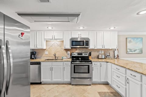 Kitchen or kitchenette, dishwasher, microwave, oven, stove, toaster