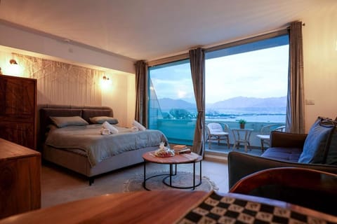 Bed, Living room, Seating area, Sea view