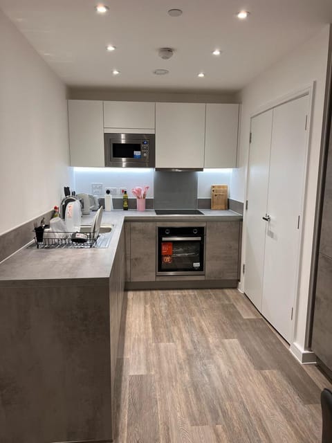 Kitchen or kitchenette, dishwasher, oven, stove, toaster