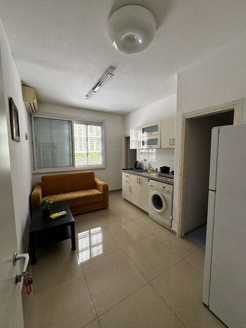 Kitchen or kitchenette, Living room, Seating area, stove, washing machine, air conditioner
