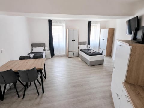 TV and multimedia, Kitchen or kitchenette, Photo of the whole room, Seating area, Dining area, Bedroom, wardrobe
