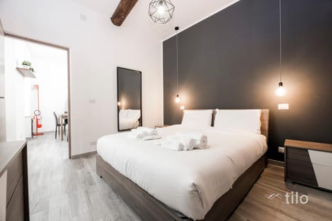 Bed, fireplace, towels