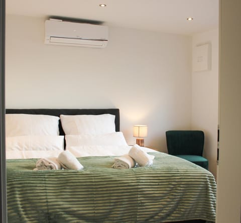 Bed, Photo of the whole room, Bedroom, towels, air conditioner