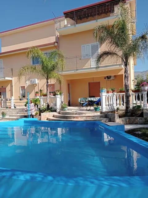 Property building, Patio, Day, Pool view, Swimming pool, Parking, sunbed
