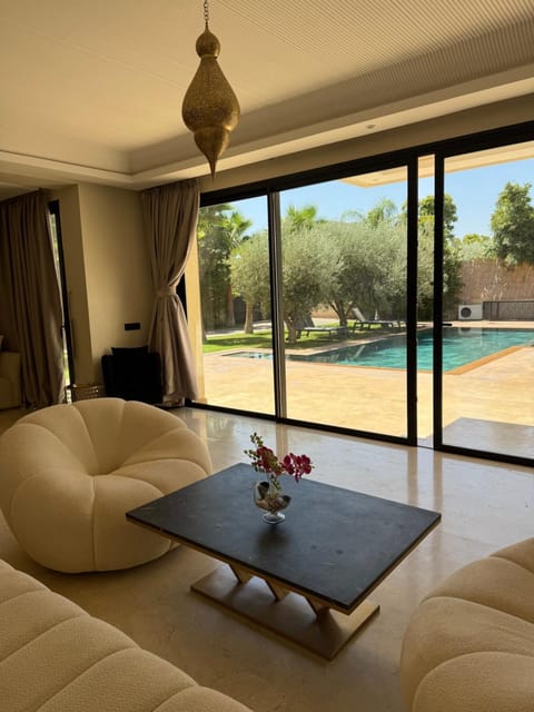 Living room, Seating area, Pool view