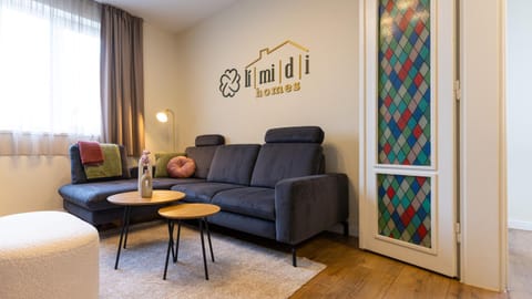 Property logo or sign, Property logo or sign, Living room, Decorative detail, Seating area