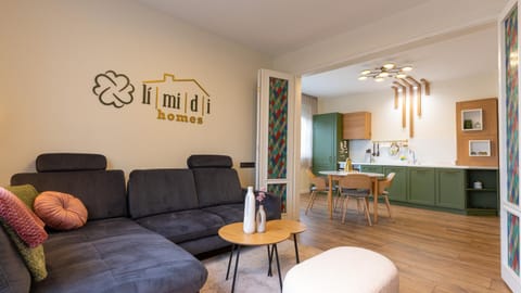 Property logo or sign, Living room, Seating area, Dining area, kitchen