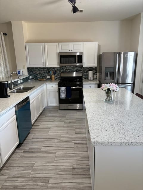 Kitchen or kitchenette, dishwasher, oven, stove, toaster