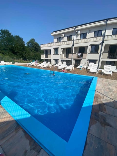 Property building, Pool view, Swimming pool, sunbed
