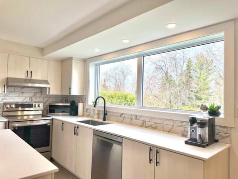 Kitchen or kitchenette, dishwasher, oven, stove, toaster